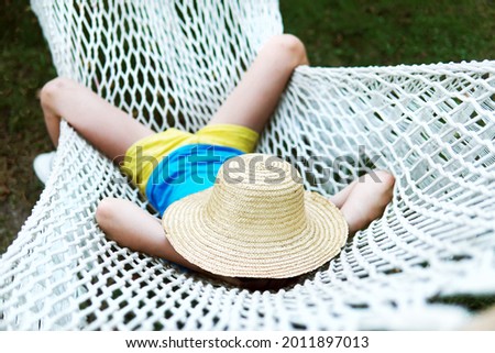 Young woman relaxing in a hammok