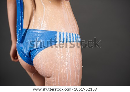 Similar – Anonymous woman applying sunscreen by the poolside