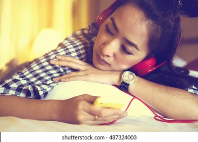 Girl Listen To Music With Smart Phone Sad Song On Bedroom 