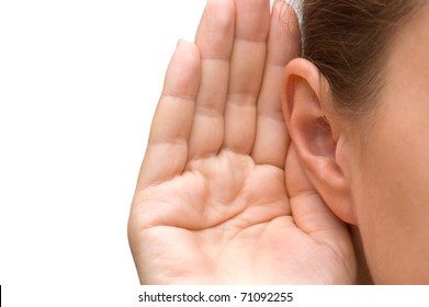 Girl listening with her hand on an ear