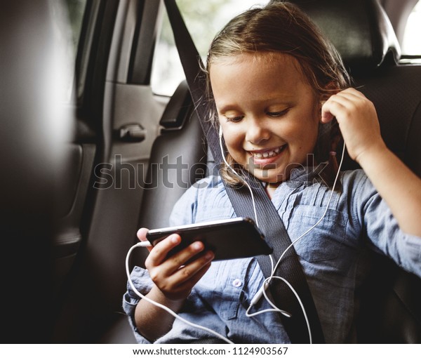 Girl listening to music in\
the car