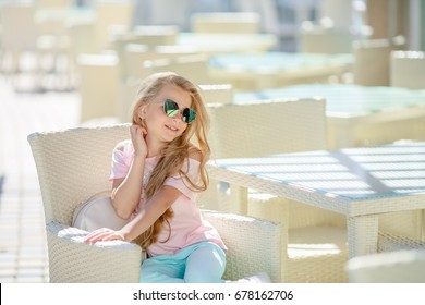 Girl with long blond hair in sunglasses - Shutterstock ID 678162706