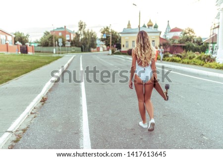 Similar – Image, Stock Photo Brunette girl holding surfboard over head and walking