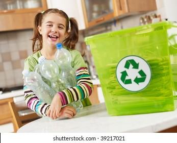 Girl looking at camera and holding plastic bottles for recycling - Powered by Shutterstock