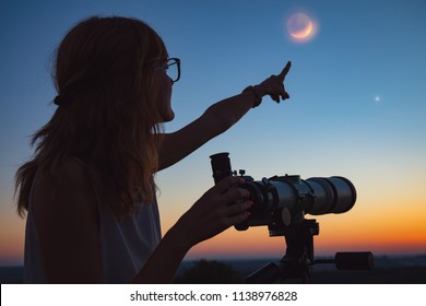 Girl Looking At Lunar Eclipse Through A Telescope. My Astronomy Work.