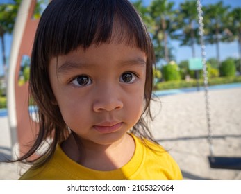 A Girl Looking At The Playground,determined Eyes