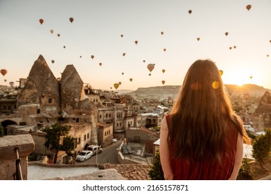 Girl Looking At Sunrise With Hot Air Balloons Over Cappadocia