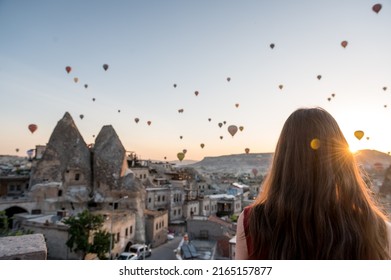 Girl Looking At Sunrise With Hot Air Balloons Over Cappadocia