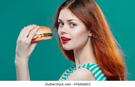 
girl looks hungry eyes and wants to eat burger
 - Shutterstock ID 476606815