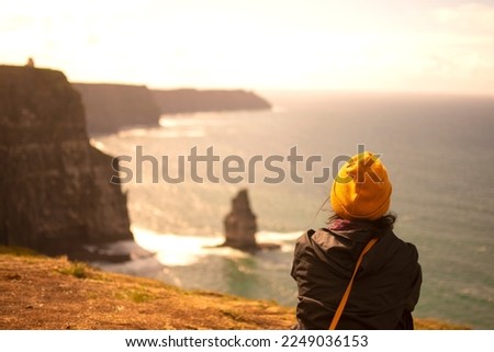 Similar – Image, Stock Photo Cliffs of Moher, woman, hiking