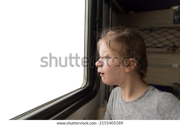 the girl looks out the train window\
with surprise. White window with a place for a\
picture