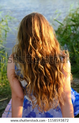 Similar – Image, Stock Photo Young woman at the stand blond hair blows around her
