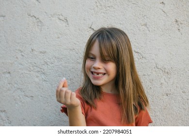 Girl Lost First Tooth Holding It In Her Hand