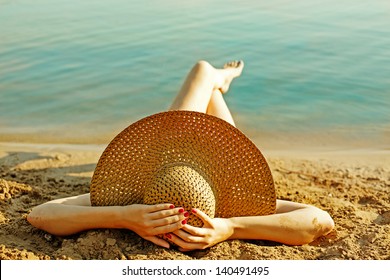 Girl Lying On The Beach