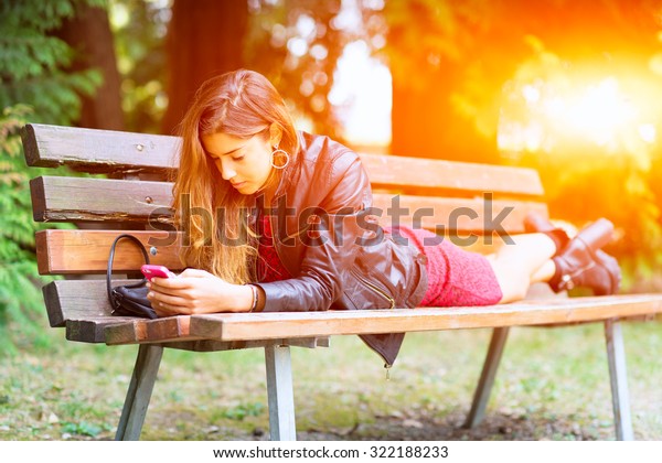 Girl Lying On Bench Using Whatsapp Stock Photo Edit Now 322188233