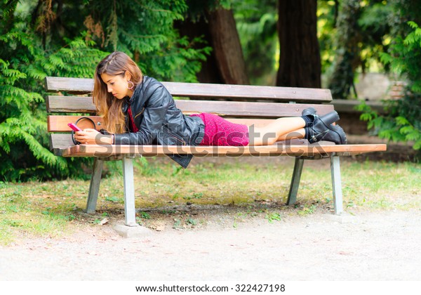 Girl Lying On Bench Using Whatsapp Stock Photo Edit Now 322427198