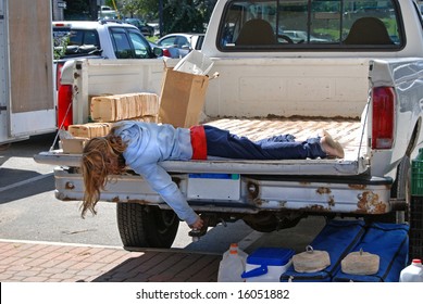 girl lying on tailgate - Powered by Shutterstock