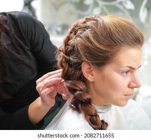 Girl Make French Braid Hairstyle In Salon