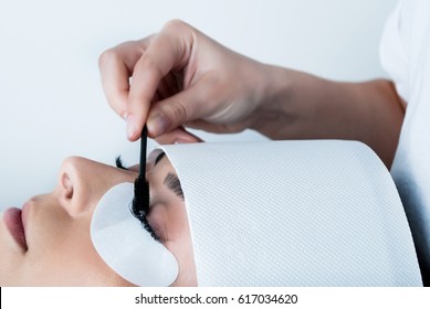 Girl Make Silk Eyelashes In A Beauty Salon