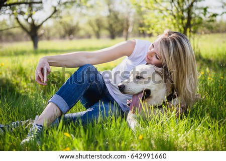 Similar – Happy smiling dog with its pretty young owner