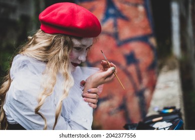 The Girl With Makeup Of The Mime. Improvisation. Suit For Halloween. Mime Shows Different Emotions. Sad Clown. A Female Mime Comedian Portrays Painting Her Face.