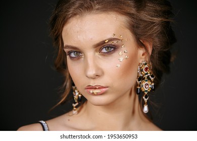 girl with makeup on a black background