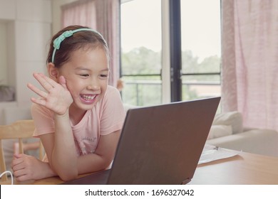 Girl Making Facetime Video Calling With Laptop At Home, Using Zoom  Online Virtual Class , Social Distancing,homeschooling,learning Remotely During Covid Coronavirus Pandemic, New Normal Concept