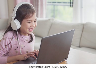 Girl Making Facetime Video Calling With Laptop At Home, Using Zoom Online Class Meeting App, Social Distancing,homeschooling,learning Remotely During Covid-19 Coronavirus, New Normal Concept