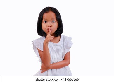 Girl Making A Keep Quiet Gesture isolated on white background