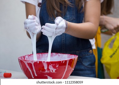 Girl Making Slime In A Pot