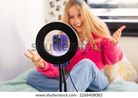 Girl making video at home and live streaming on social media