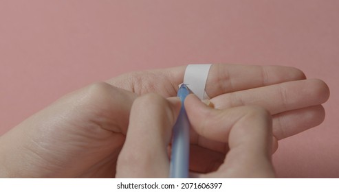 Girl measuring her ring size. Finger ring sizing tool
