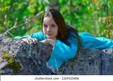 Girl In Medieval Dress In A Fairy Forest