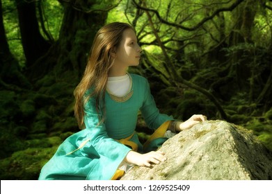 Girl In Medieval Dress In A Fairy Forest