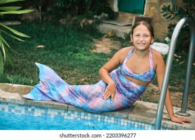 A Girl In A Mermaid Costume