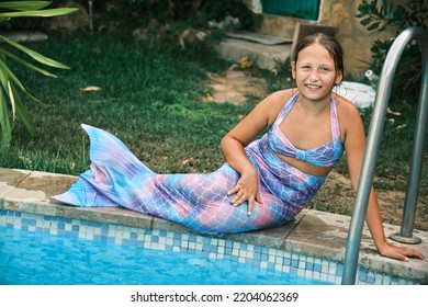 A Girl In A Mermaid Costume