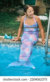 A Girl In A Mermaid Costume