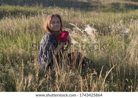 A girl in the middle of nature. Out of town in the countryside