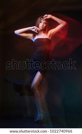 Similar – Young woman in black lingerie with red and green lighting