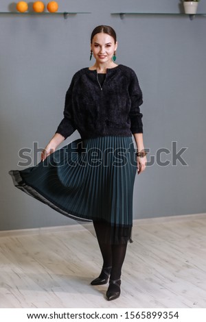 Similar – young beautiful lady posing in the living room next to a window