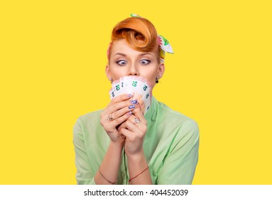 Girl With Money. Closeup Red Head Beautiful Young Woman Pretty Excited Amazed Greedy Pinup Girl Green Button Shirt Euro Cash Looking At Currency Retro Vintage 50's Hairstyle Isolated Yellow Background