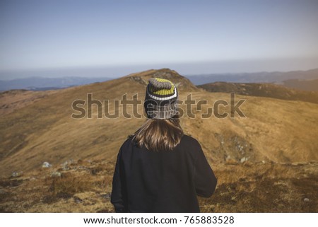 Similar – Image, Stock Photo Enjoy the view. Woman with headband, jacket. Ireland