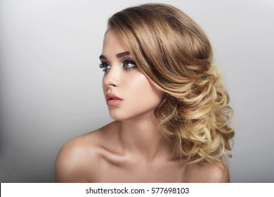 Girl With Natural Make-up A Hair-do Is Beautiful Face Of Lip Of Eye Hair Curls Blonde Portrait Spring A Skin Is Good Clean On A White Background Youth Looks Aside Health