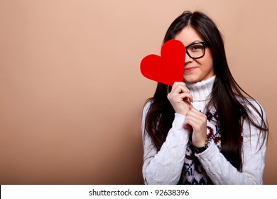Girl in nerd glasses with red heart
