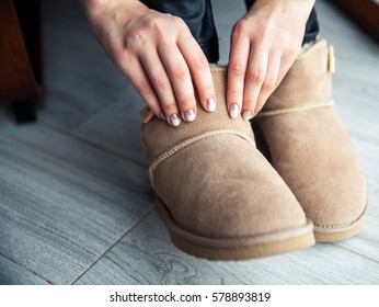 The girl with a nice manicure gray dress ugg boots. Shoes, fashion, style, modern