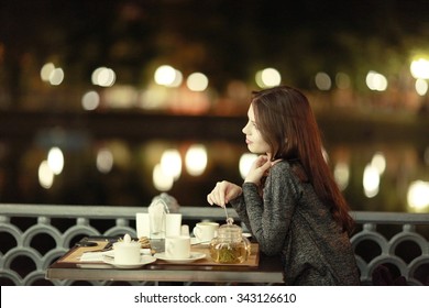 Girl, Night, Dinner At An Outdoor Cafe