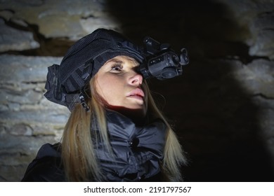 Girl With A Night Vision Device In The Dark.