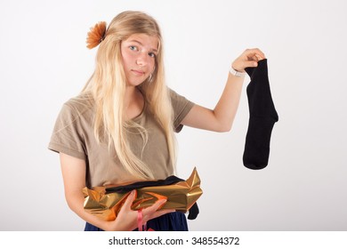 Girl not too happy with her gift found in the box - Powered by Shutterstock
