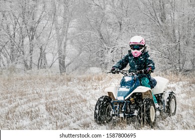 Girl On 4 Wheeler In Snow