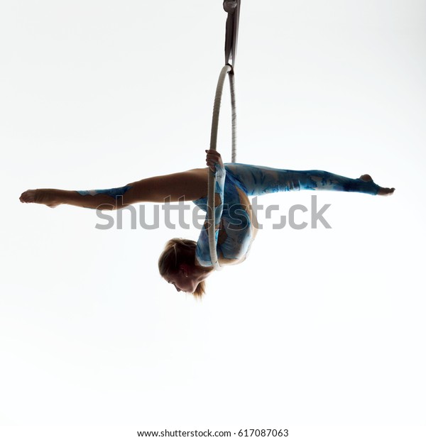 girl on the air ring gymnastics silhouette on\
the white background